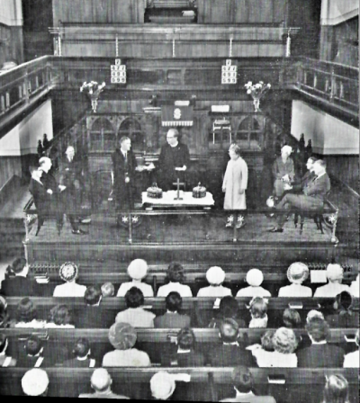 View of the old sanctuary with a communion service taking place